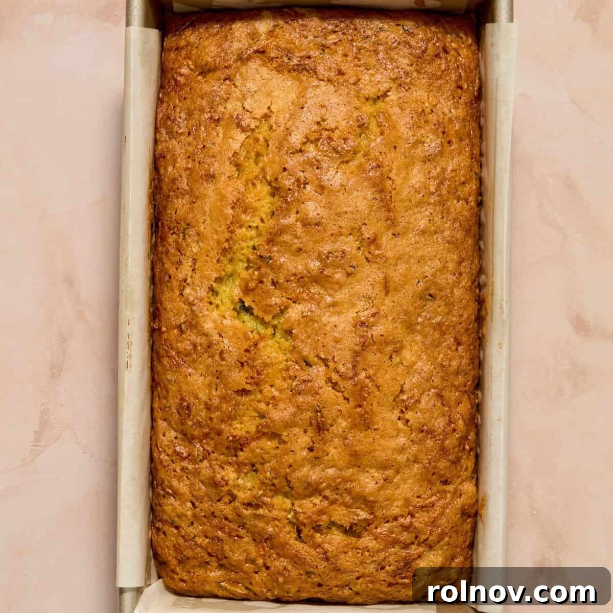 Moist Lemon Zucchini Bread with Citrus Glaze 11 Baked lemon zucchini loaf in pan.