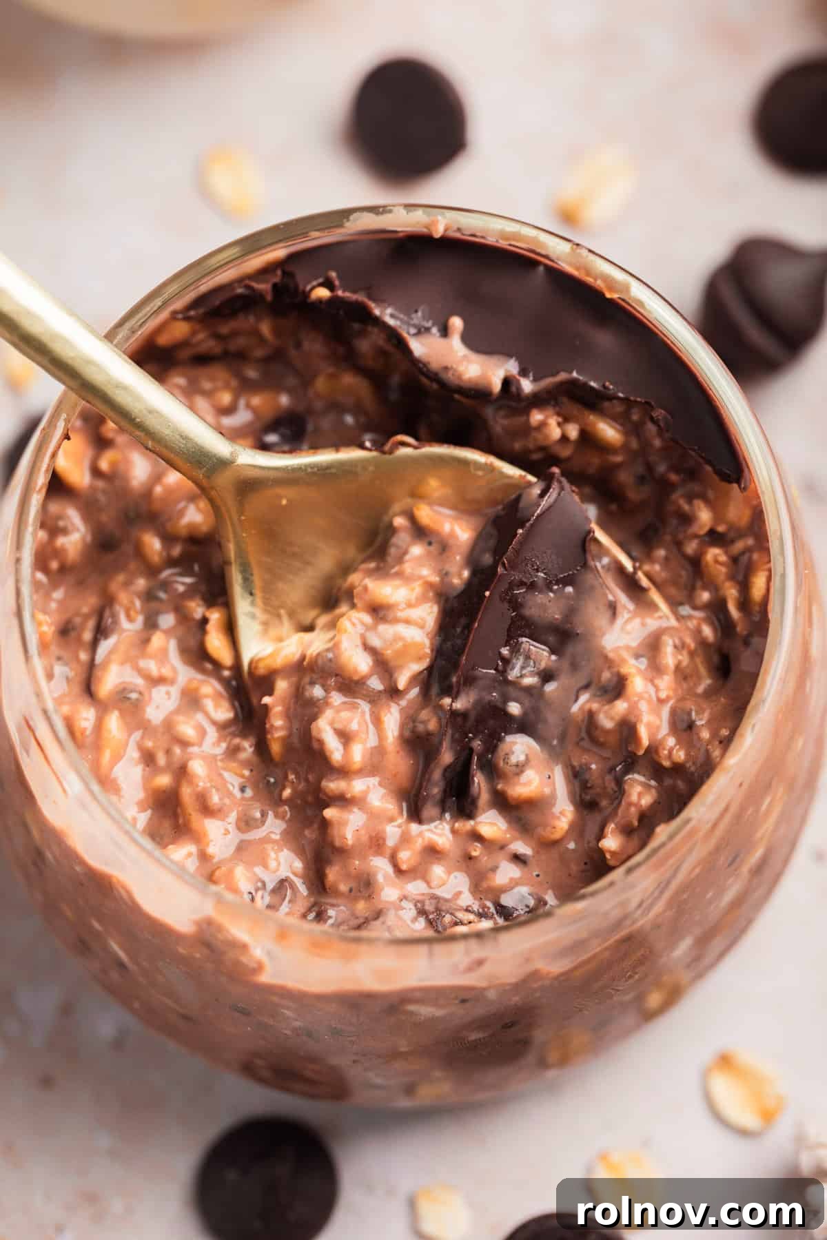 Chocolate protein overnight oats with chocolate shell in jar.