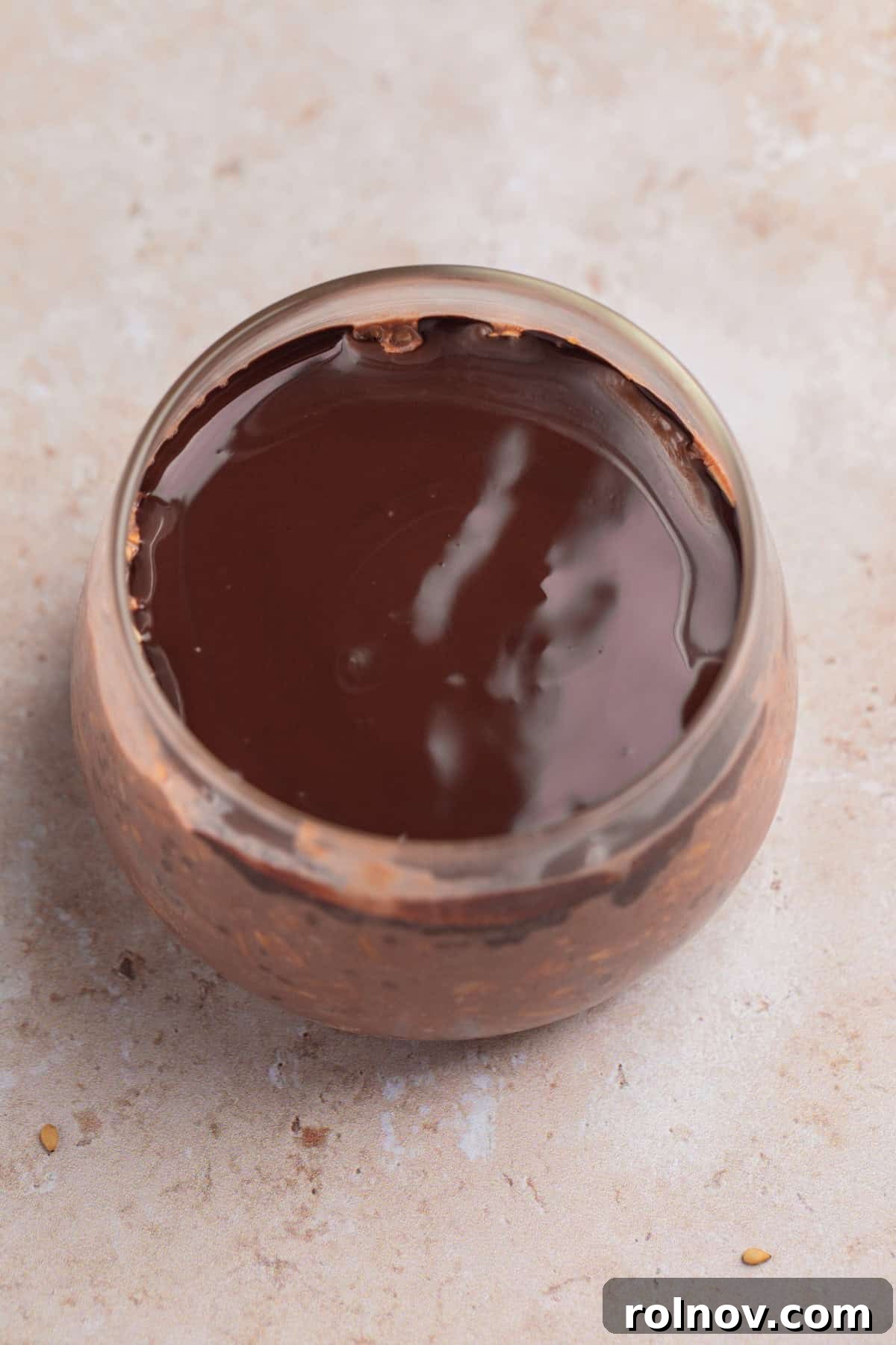 Melted chocolate over chocolate oatmeal.