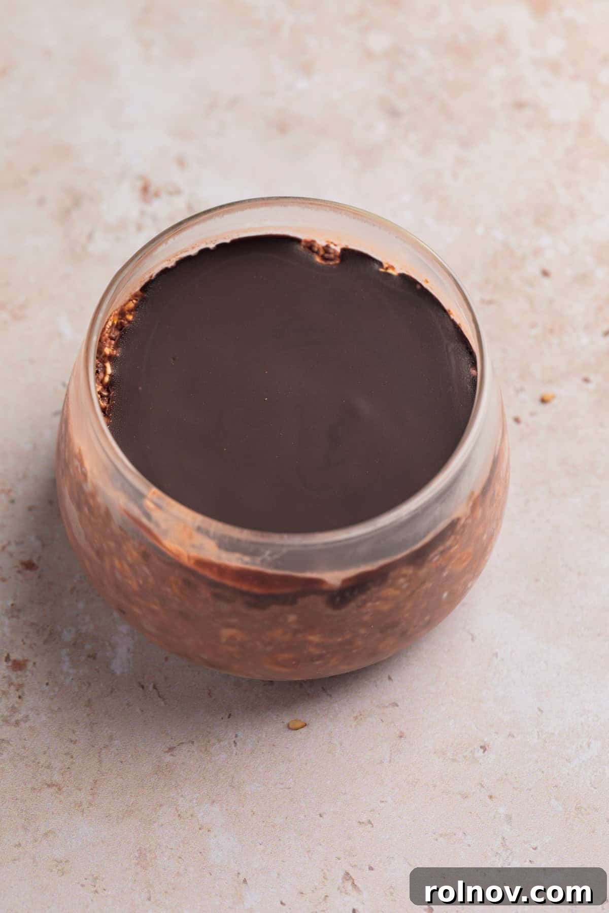 Magic shell coated chocolate overnight oatmeal in jar.