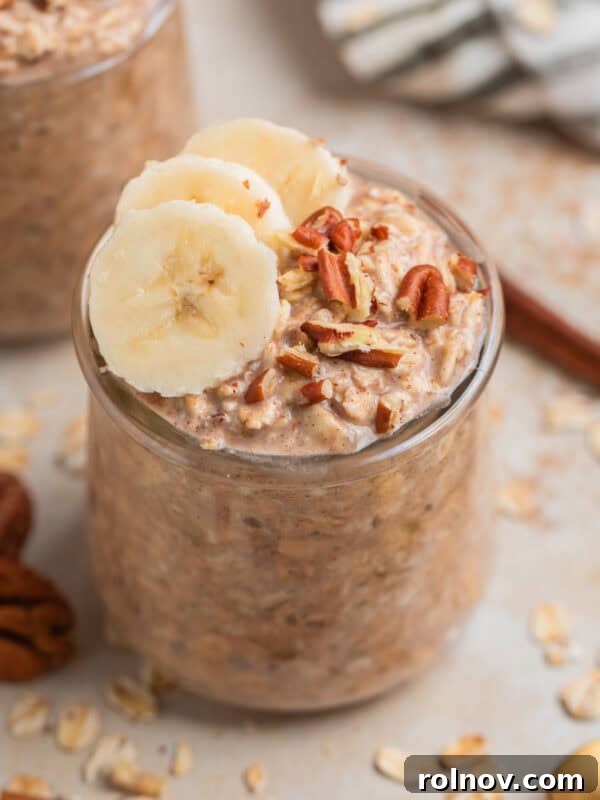 Glass jar with overnight oatmeal topped with bananas and nuts.
