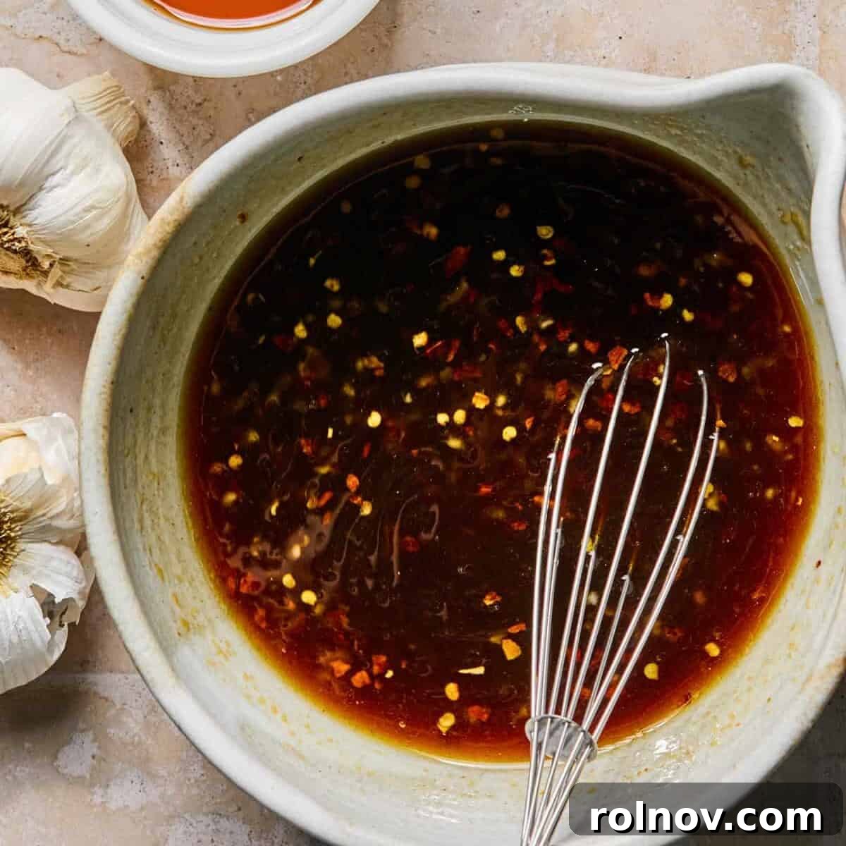 Sticky Honey Sriracha Slow Cooker Chicken 6 Honey sriracha sauce whisked together in mixing bowl.