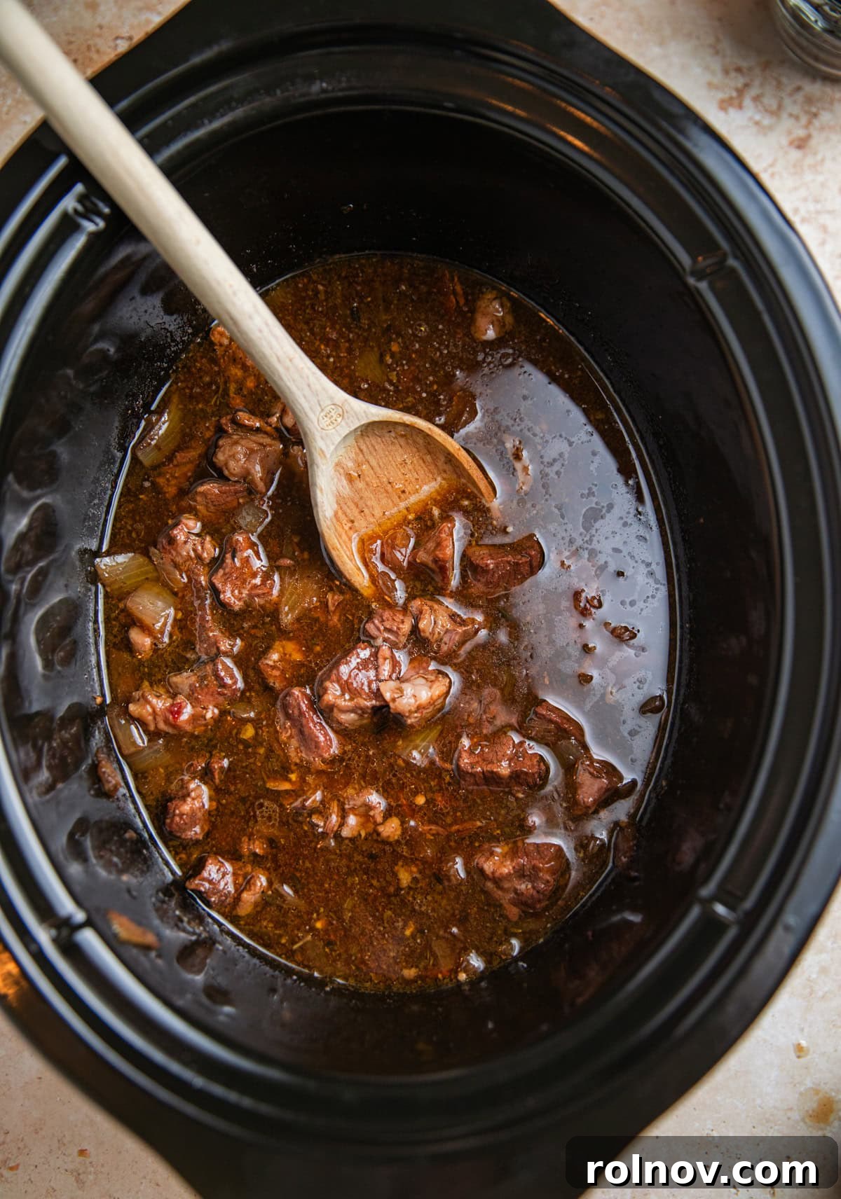 Slow cooker beef tips in gravy prepared.