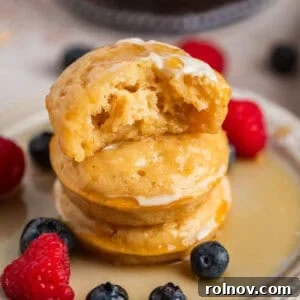 Stack of pancake bites with bite taken out of top piece.