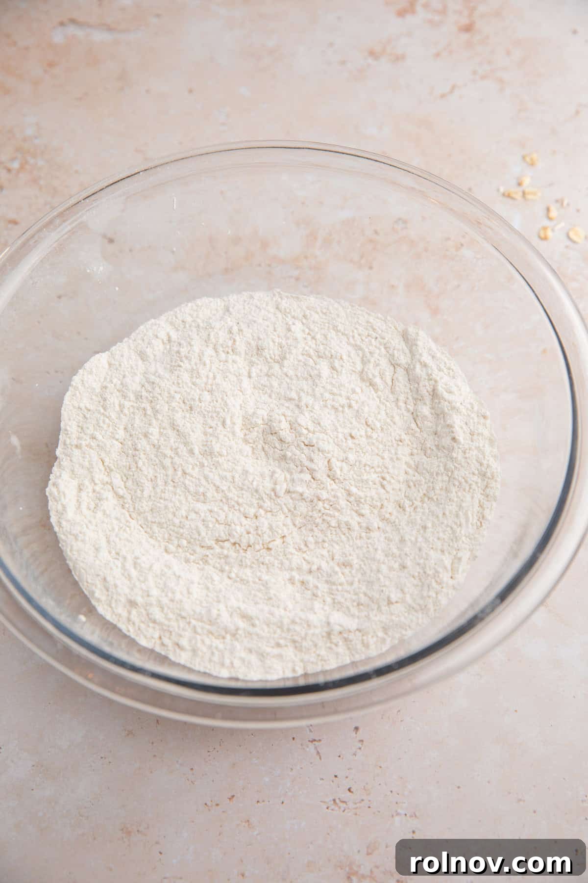 Dry ingredients mixed in glass bowl.