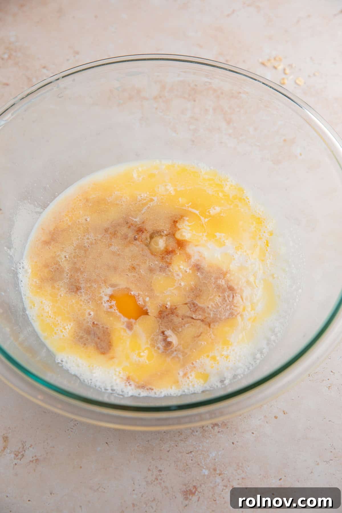 Wet ingredients added to glass bowl before mixing.
