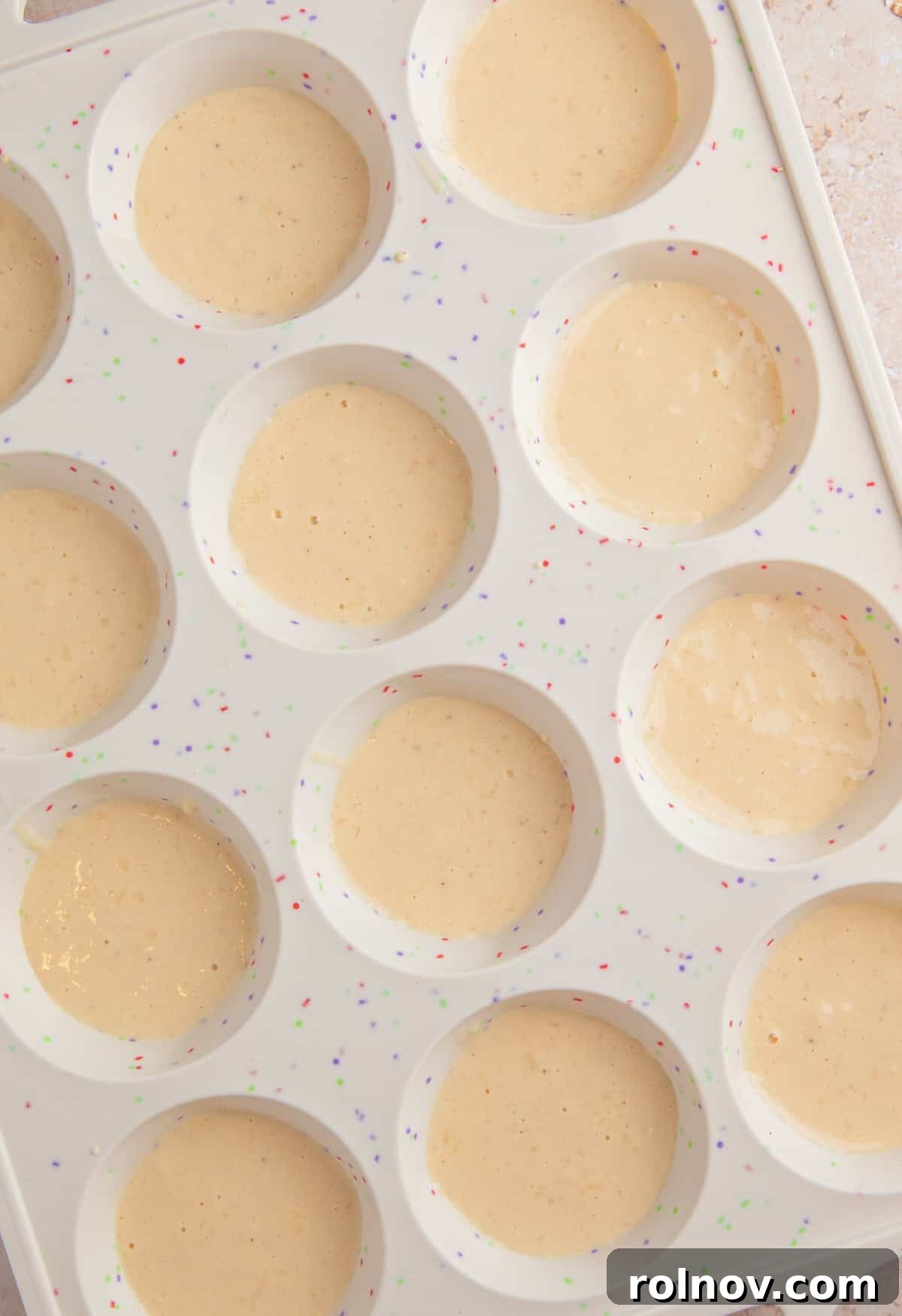 Pancake bite batter in silicone muffin pan.