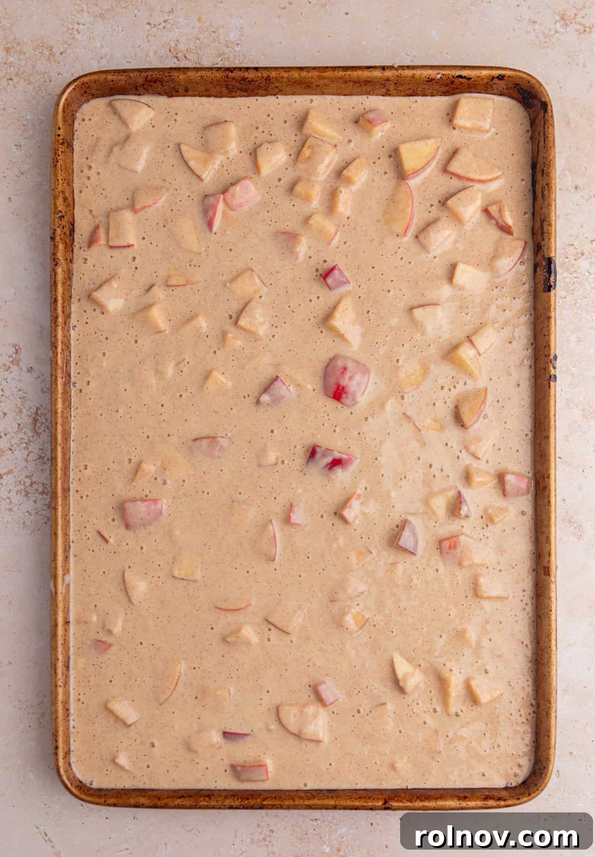 Sheet-Pan Apple Pancakes with Cinnamon 8 Sheet pan apple protein pancake batter on sheet pan before baking.