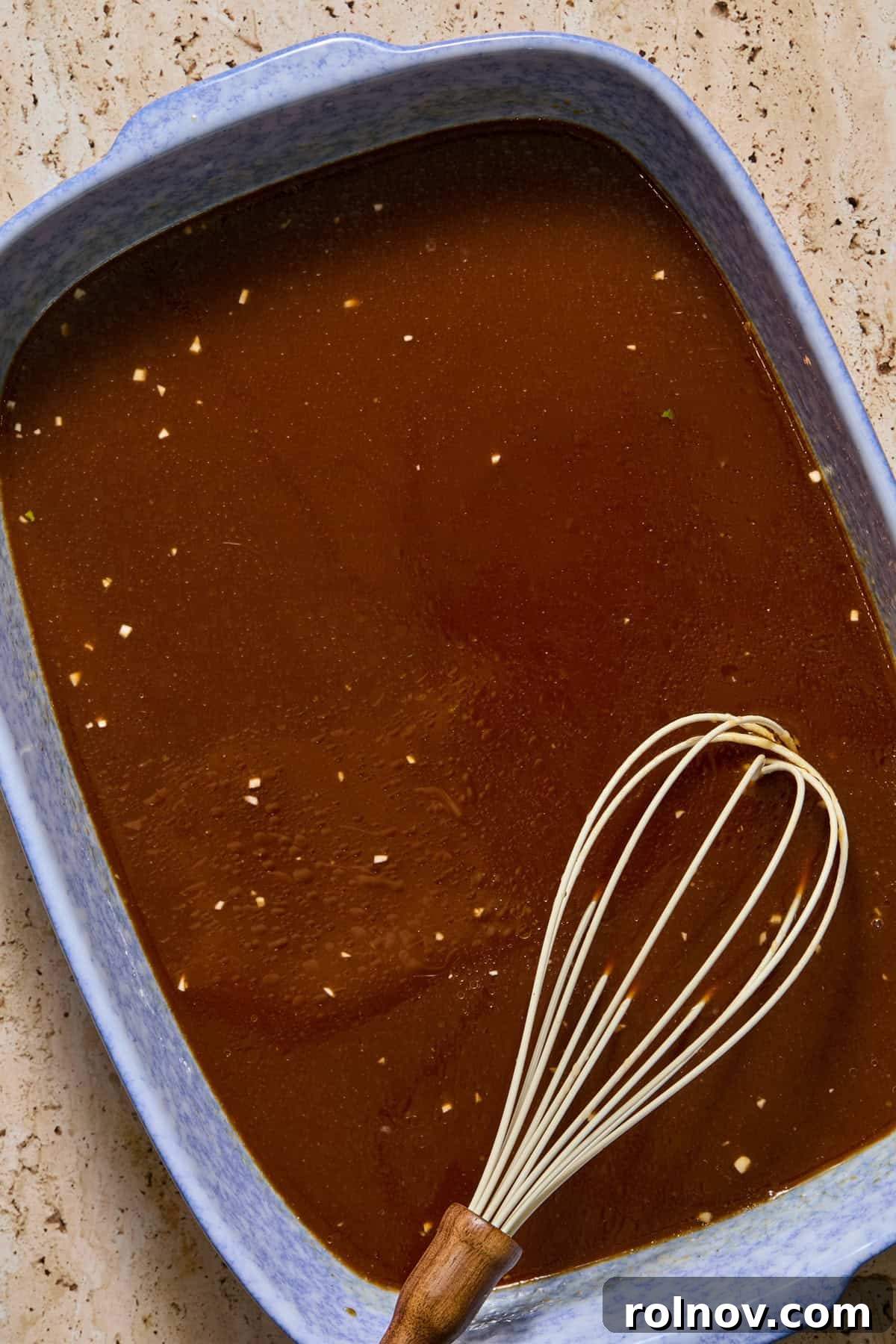 Whisked ramen sauce ingredients in pan.