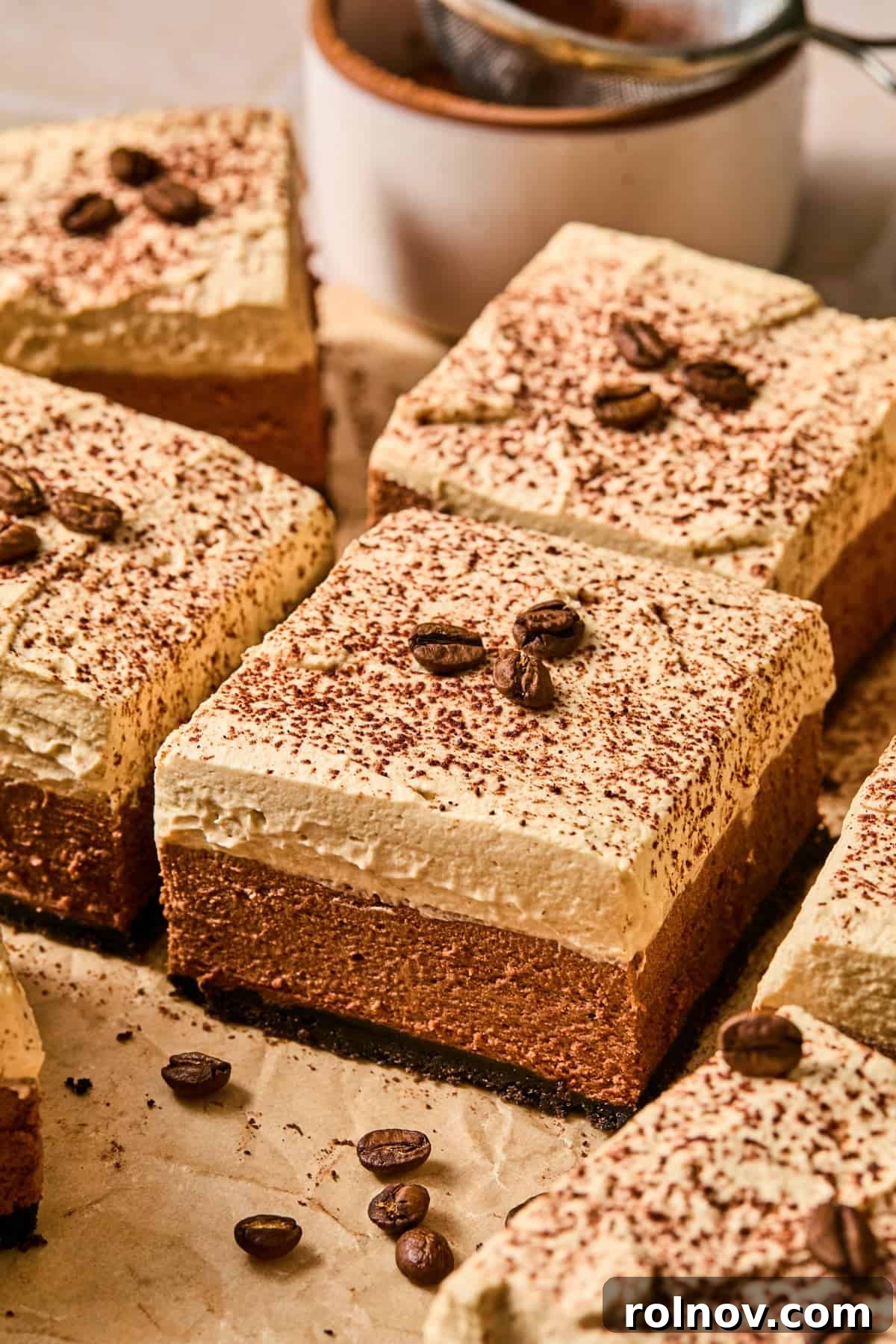 Espresso Martini Bars Near You: Where to Go Tonight 2 Espresso martini bars on parchment topped with espresso beans.