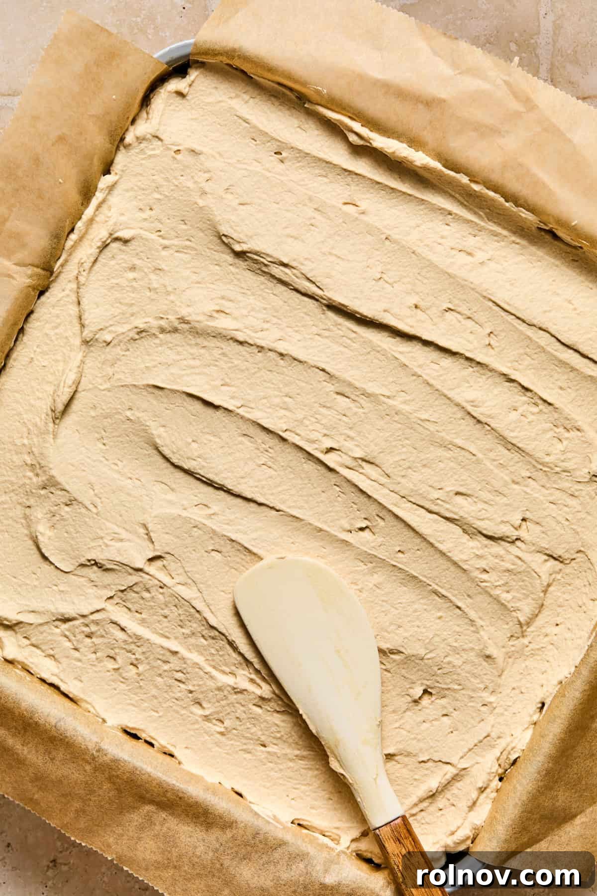 Espresso Martini Bars Near You: Where to Go Tonight 14 Mascarpone espresso whipped cream being spread over chocolate layer.