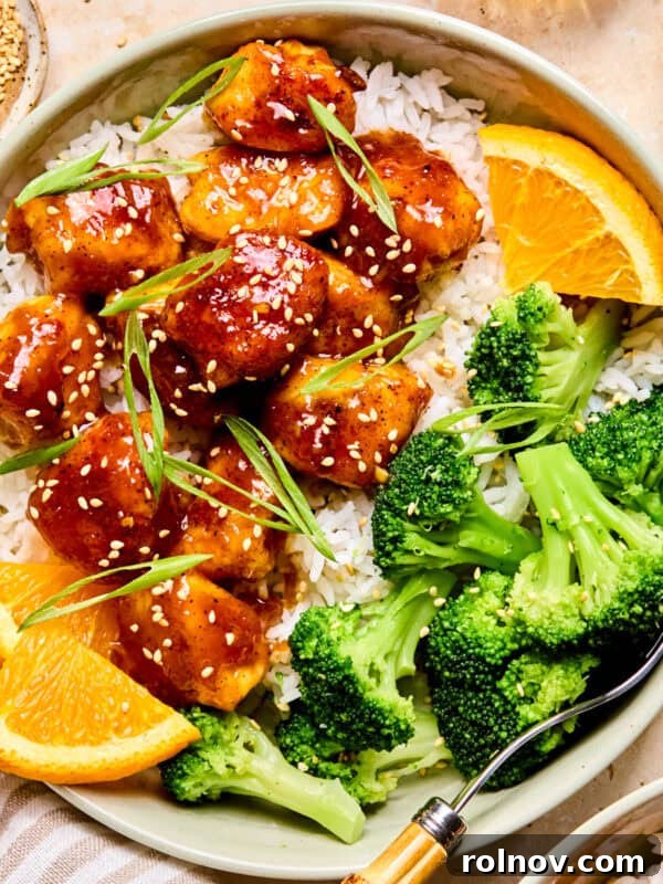 Cheesy Sloppy Joe Casserole for Family Weeknight Dinners 17 Spicy orange chicken over rice with broccoli and orange slices.