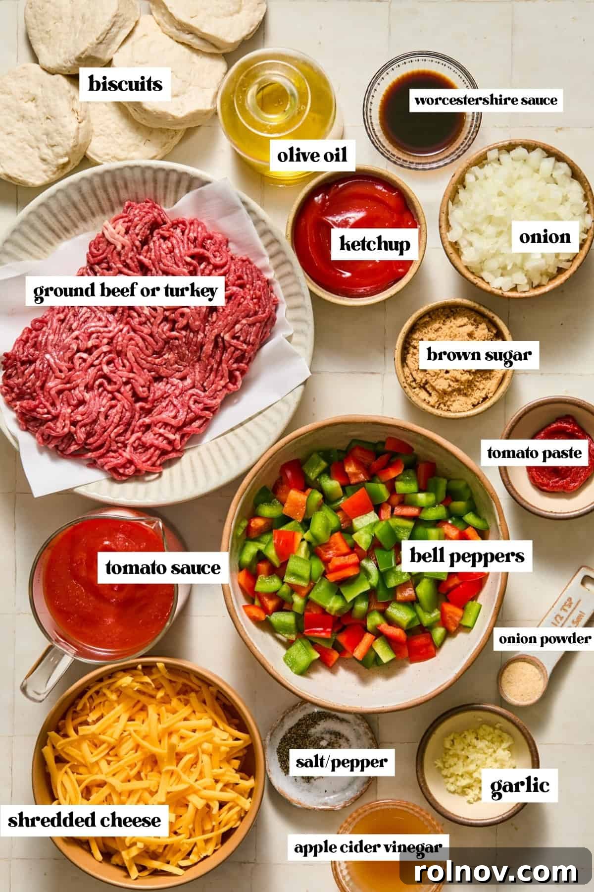 Cheesy Sloppy Joe Casserole for Family Weeknight Dinners 4 Meat, vegetables, ketchup, seasoning and other ingredients labeled on surface.