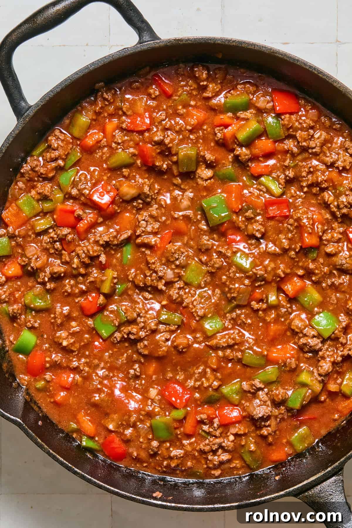 Cheesy Sloppy Joe Casserole for Family Weeknight Dinners 9 Simmered sloppy joe mixture in skillet.