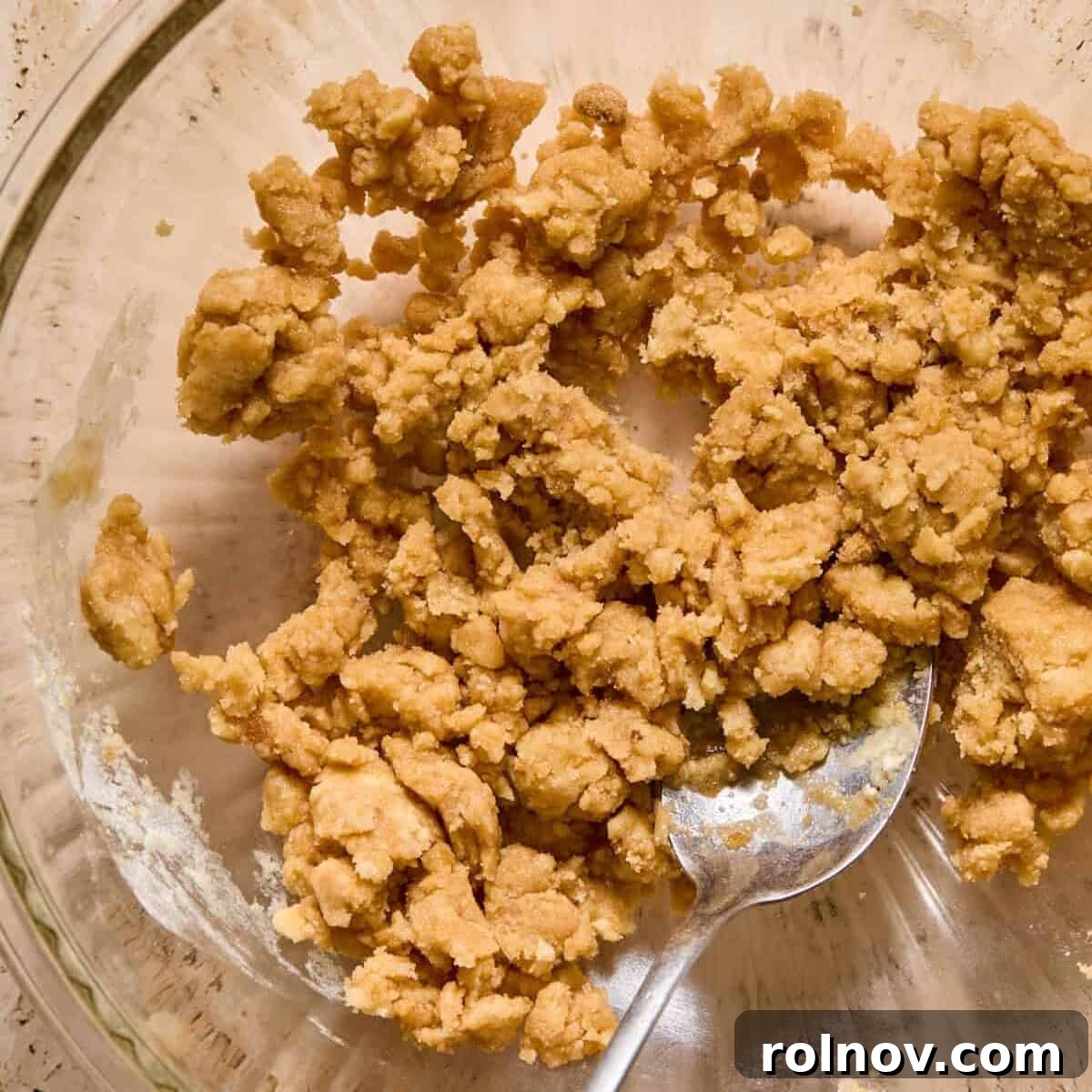 Cobbler mixture in glass bowl with spoon.