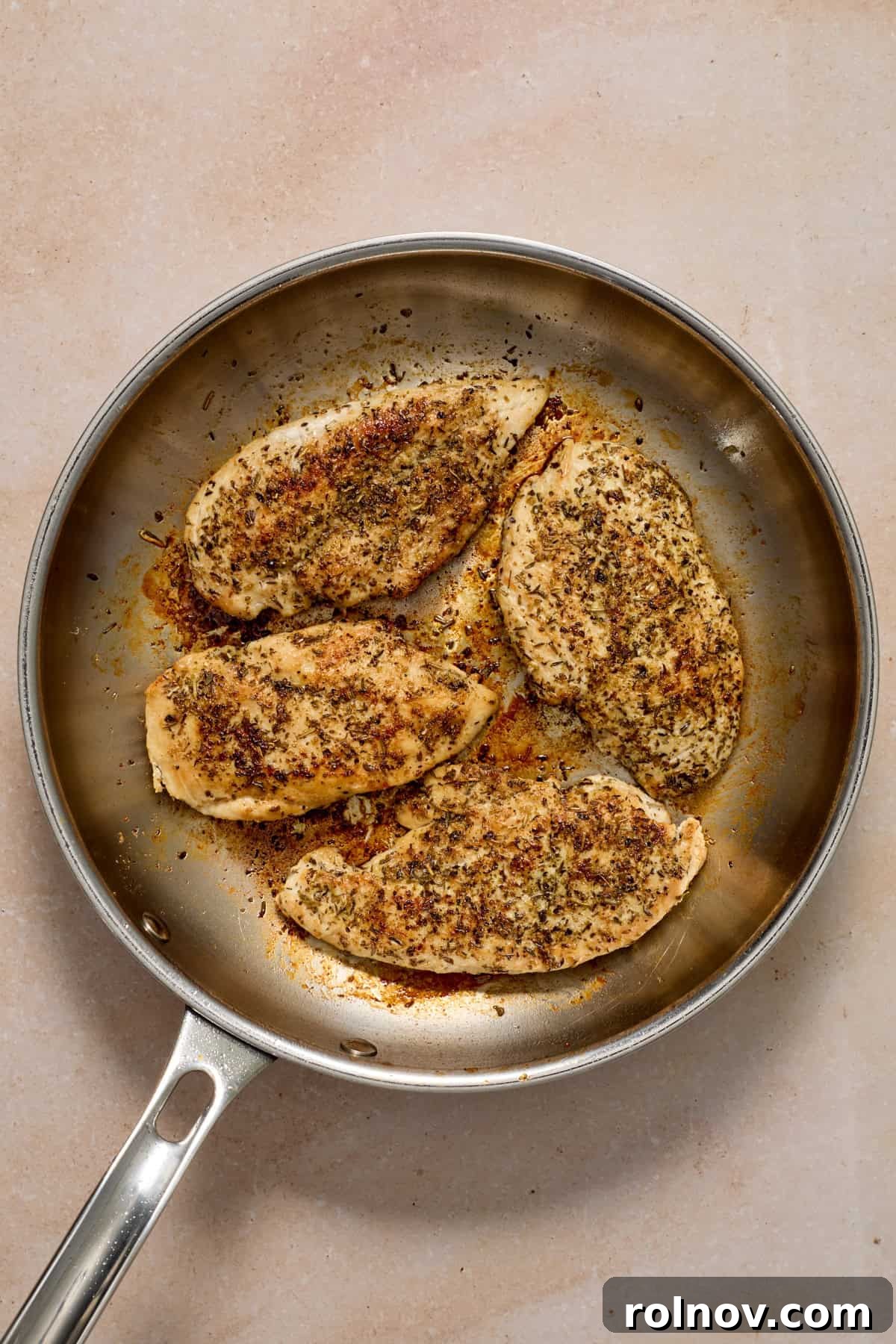 Creamy Garlic Parmesan Chicken Recipe 6 Seared chicken cutlets in skillet.