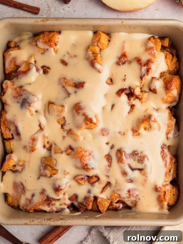 Apple pie biscuit bake in pan with icing.