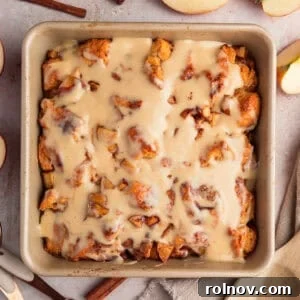 Warm Apple Cinnamon Biscuit Casserole 15 Apple pie biscuit bake in pan with icing.
