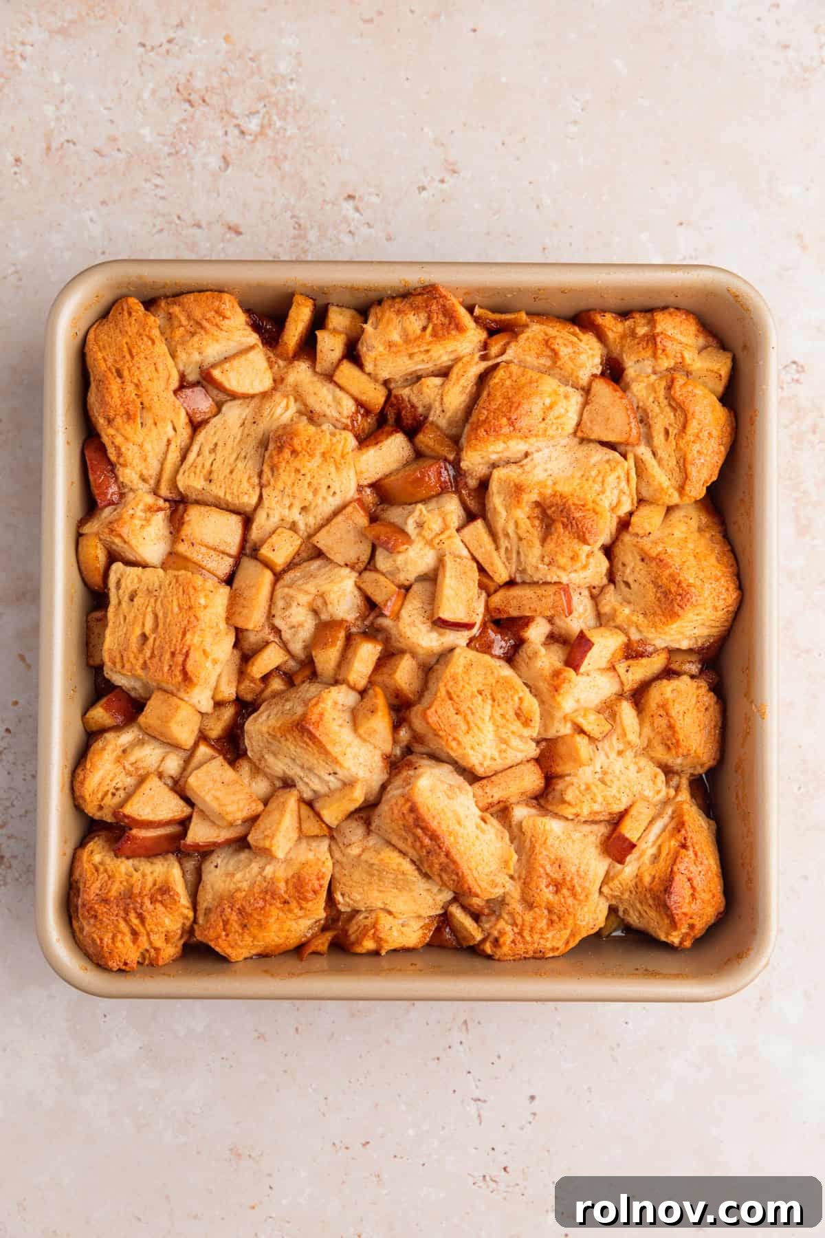 Warm Apple Cinnamon Biscuit Casserole 7 Baked apple cinnamon biscuit recipe in pan.