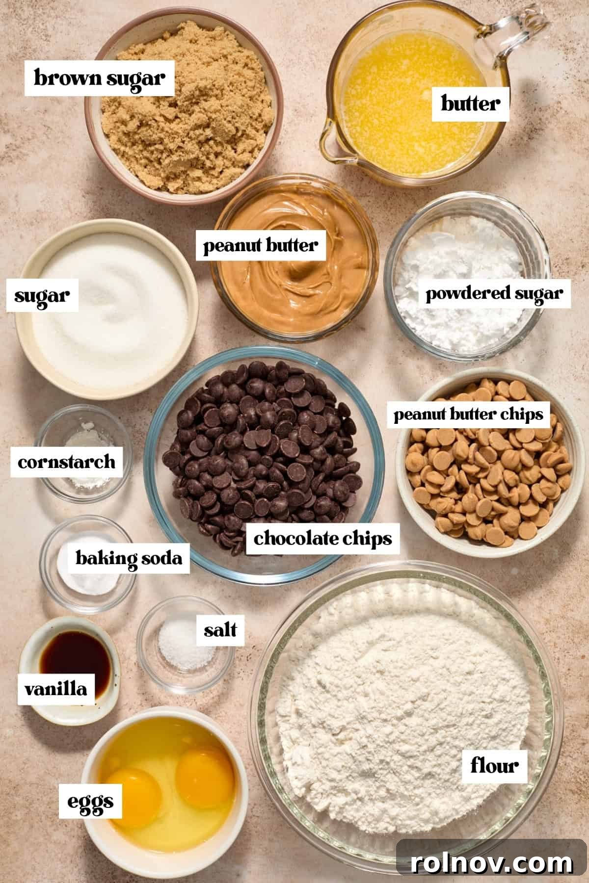 Brown sugar, flour, eggs and other labeled ingredients on surface.