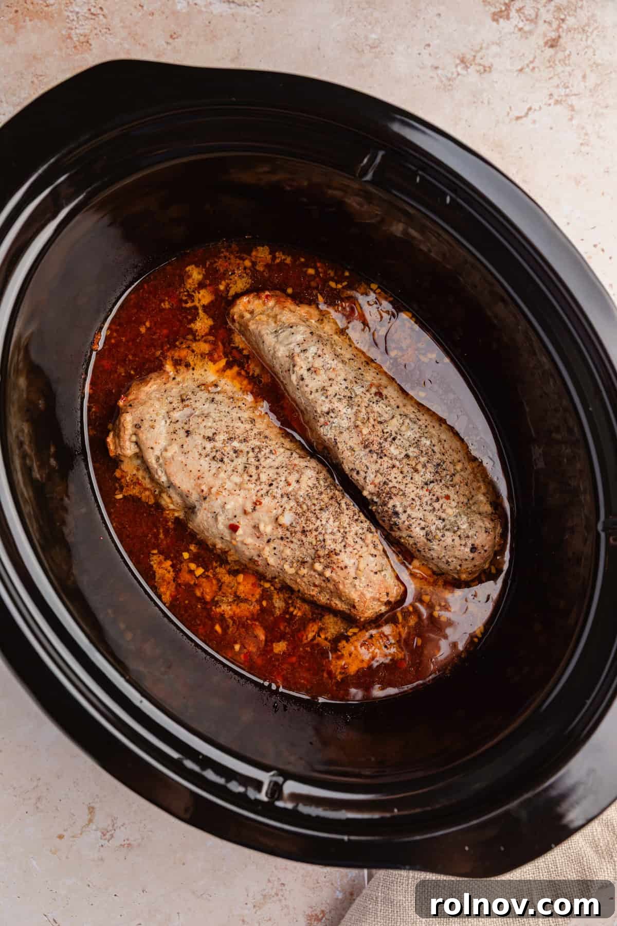Honey Garlic Pork Tenderloin in the Slow Cooker 7 Cooked pork tenderloin in slow cooker.