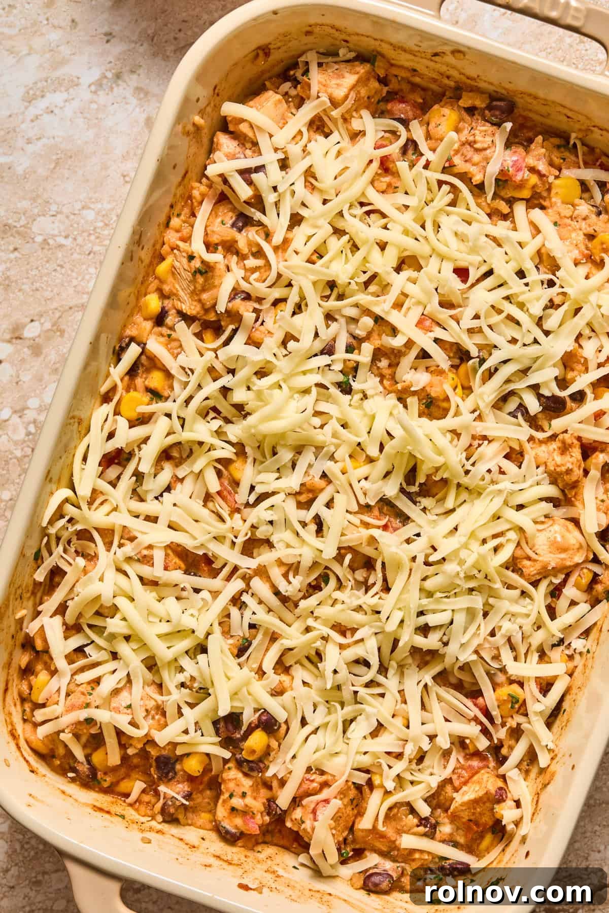 Cheesy Taco Chicken and Rice Casserole 10 Shredded pepper jack cheese on chicken and rice bake before melting