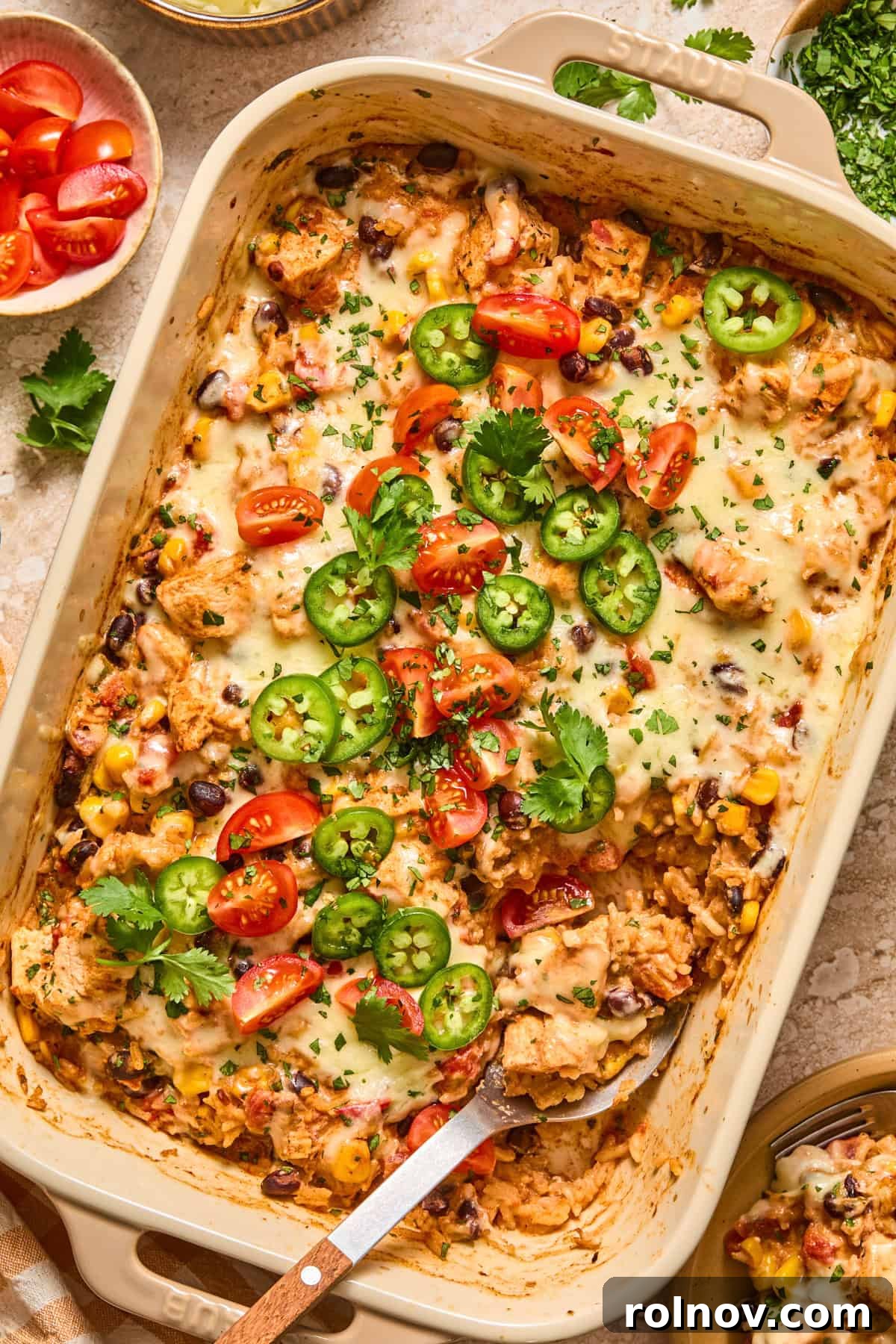 Cheesy Taco Chicken and Rice Casserole 11 Chicken taco rice bake with serving spoon