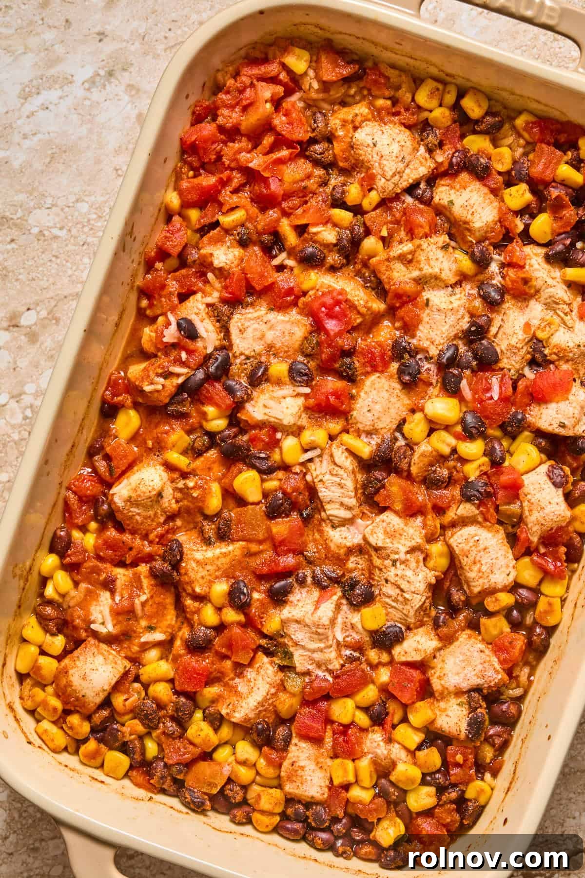 Cheesy Taco Chicken and Rice Casserole 8 Baked chicken and rice taco casserole in pan