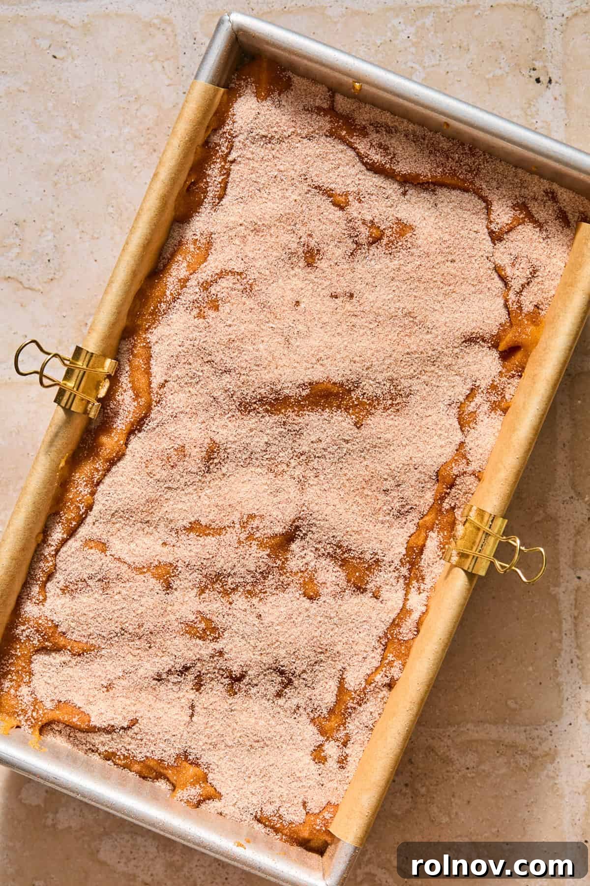 Cinnamon Pumpkin Bread with Cream Cheese Swirl 13 Cinnamon and cream cheese swirl pumpkin bread batter prepped in pan before baking.