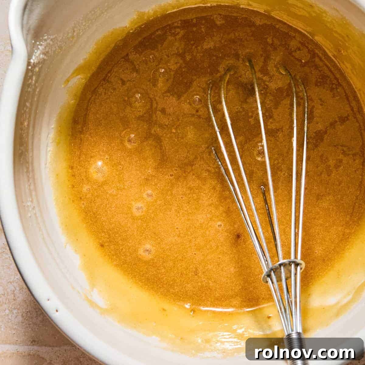 Cinnamon Pumpkin Bread with Cream Cheese Swirl 6 Eggs, brown sugar and regular sugar whisked in bowl.