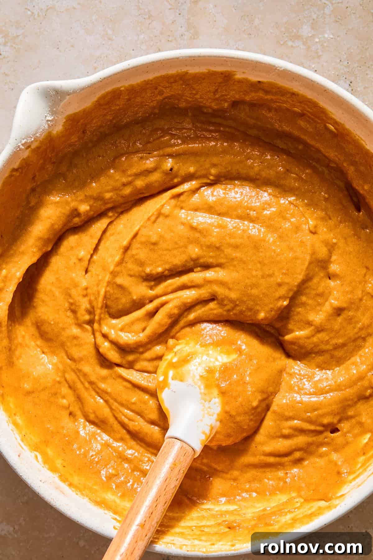 Cinnamon Pumpkin Bread with Cream Cheese Swirl 8 Pumpkin bread batter in bowl with spatula.