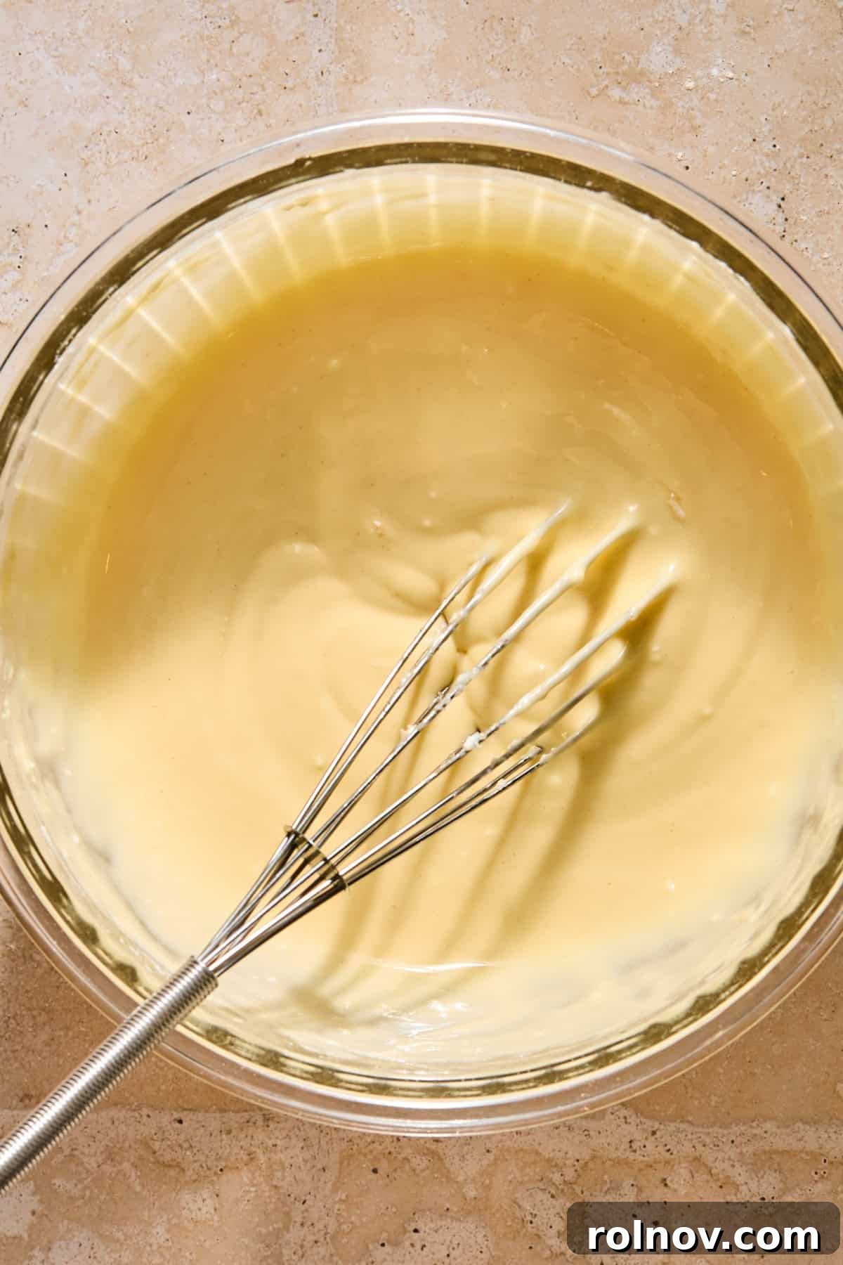 Cinnamon Pumpkin Bread with Cream Cheese Swirl 10 Cream cheese mixture in bowl with whisk.